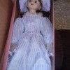 A porcelain doll, still in the original box.