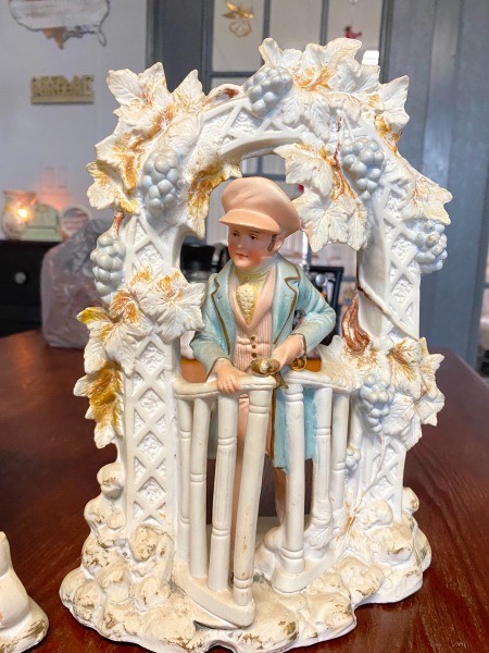 A decorative figurine of a woman.