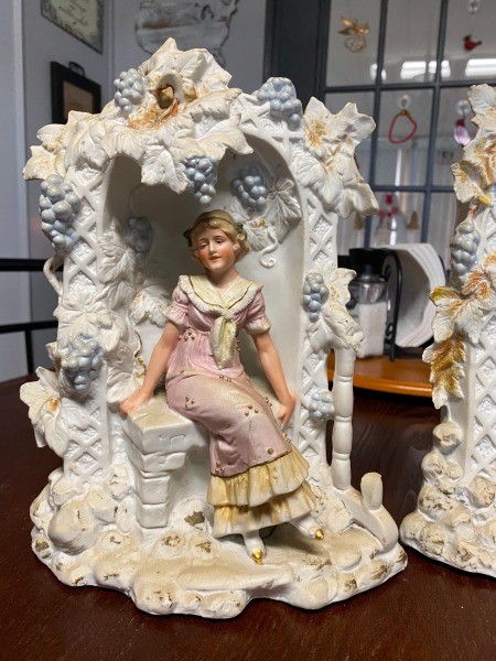 A decorative figurine of a woman.