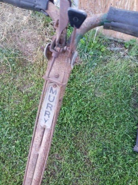 The handle of a Murry lawn mower.