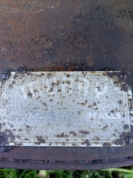 An identification plate on a lawn mower.