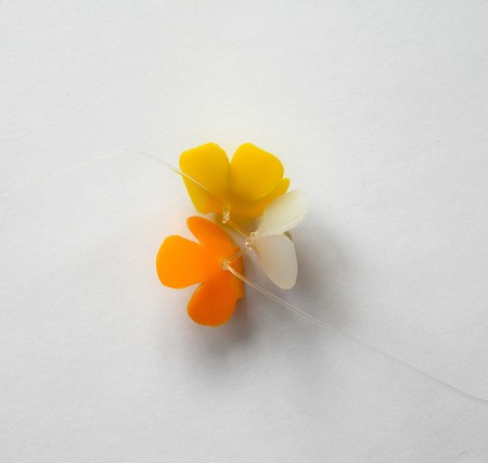 Sewing the flowers together.