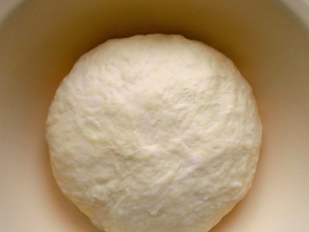 A ball of dough in a bowl.