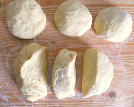 Dividing the dough into smaller balls.