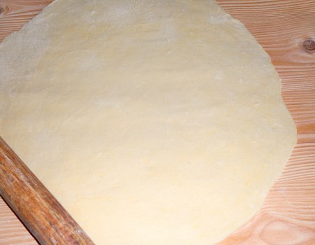 Rolling out the dough.