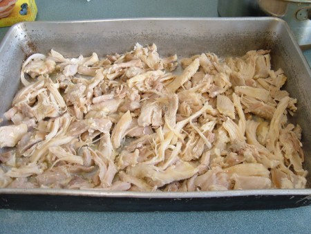 Shredded chicken in a pan.