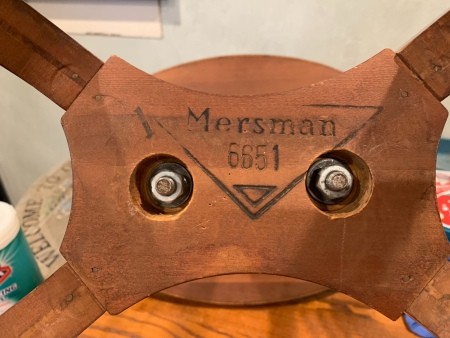 The Mersman marking on the underside of a wooden table.