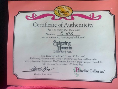 The certificate of authenticity for a set of porcelain dolls.