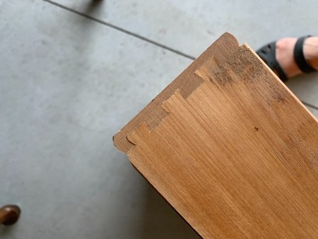 The construction of a wooden drawer in a table.