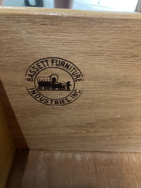 A Bassett furniture marking inside a drawer.