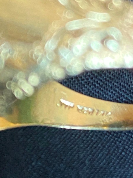 Writing inside a gold ring.