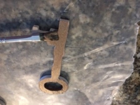 Painting the key shapes in metallic colors.