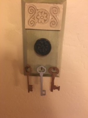 Skeleton keys hanging from a plaque.