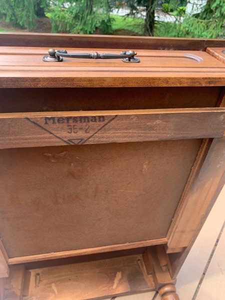 The Mersman marking on the bottom of a table.