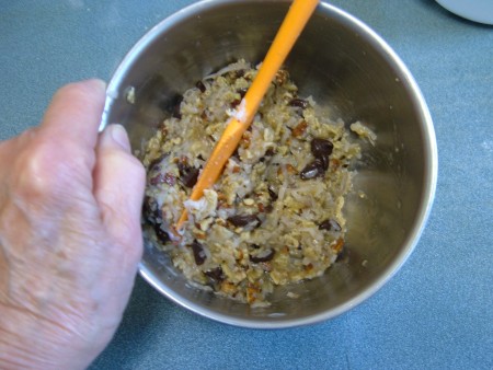 Mixing together the ingredients in a bowl.