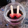 Adding a popsicle to a cola drink to cool it down.