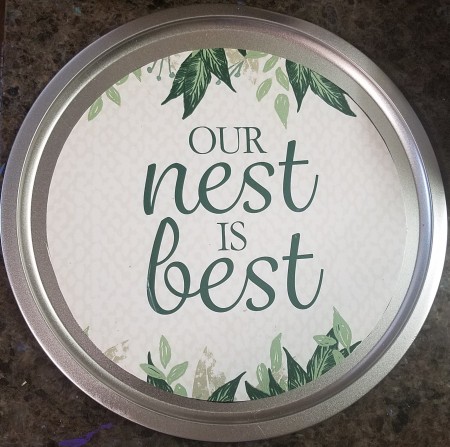 Adding "Our Nest Is Best" print to the center of the pizza pan.