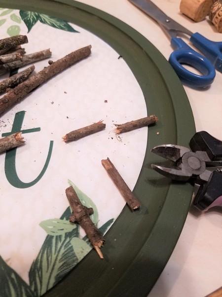 Cutting the twigs into small pieces.