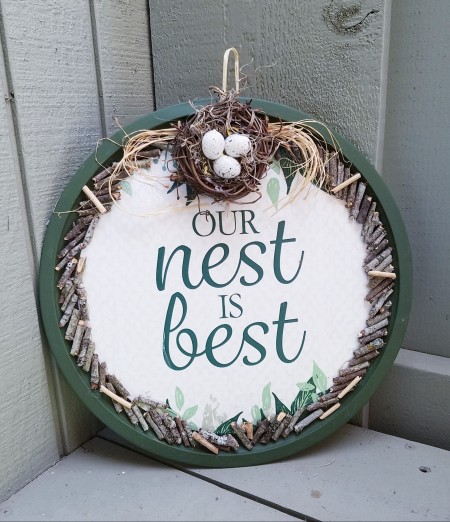 The completed Our Nest is Best Pizza Pan Craft