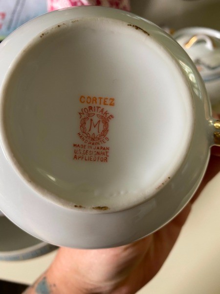 A mark on the bottom of the china cup.