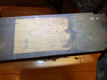 The marking on the underside of a chair.