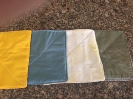 Several different reversible hot pads.
