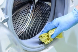 A washing machine being cleaned.