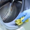 A washing machine being cleaned.