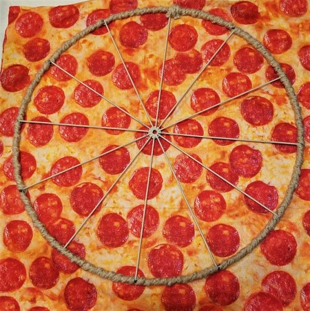 The wire form with the crocheted chain attached to the outside.