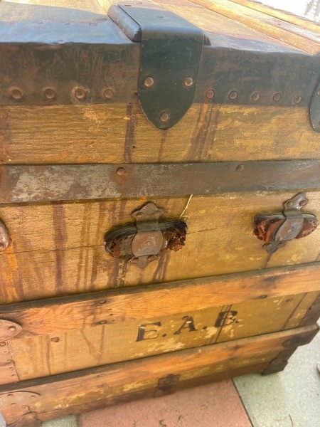 The side of a wooden trunk.