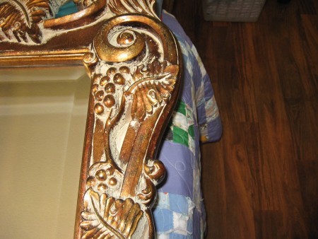 A close up of the carved mirror.