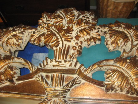 A close up of the carved mirror.