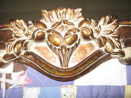 A close up of the carved mirror.