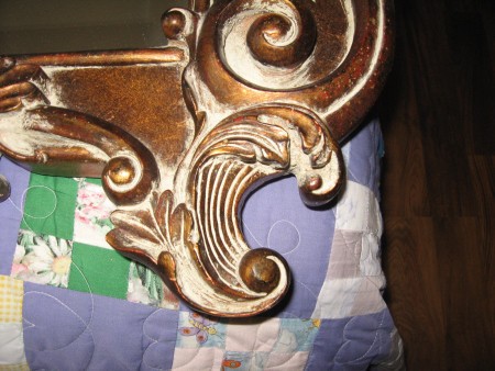 A close up of the carved mirror.