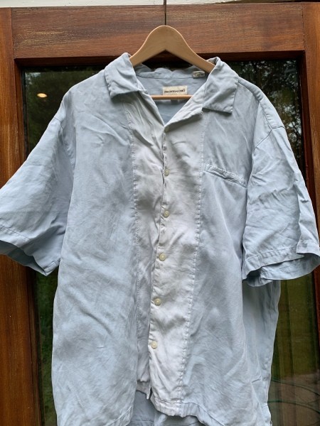 A shirt that has the blue color bled into the white.