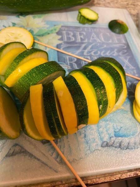 Assembling the kabobs.