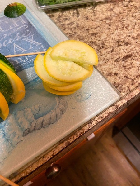 Assembling the kabobs.