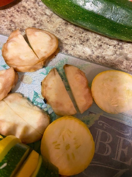 Cutting the vegetables into slices.