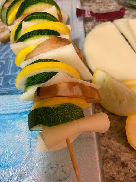 Assembling the kabobs.