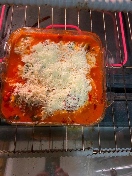 Putting the kabobs in the oven.