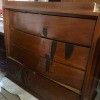 An antique dresser stored upside down.