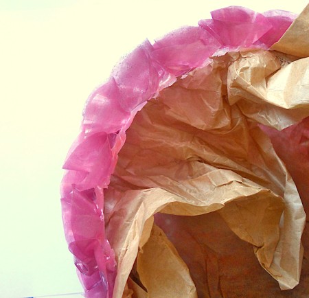 Attaching the folded circles to the paper.