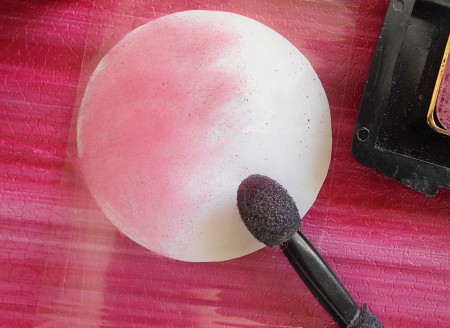 Coloring the sticky side with eyeshadow.