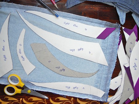 Using the template to cut out the fabric.