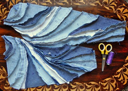 Several pieces of denim cut out.