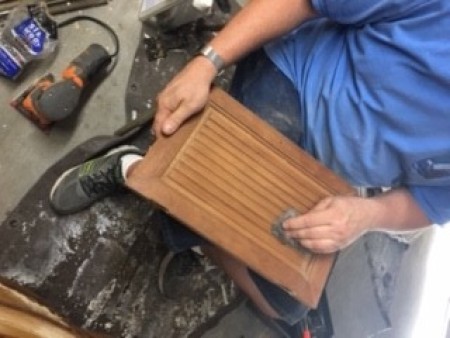 Cleaning up the doors of the buffet.