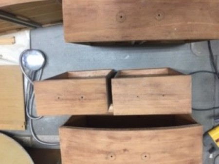 Cleaning up the drawers of the buffet.