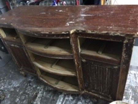 Removing the drawers from the buffet.