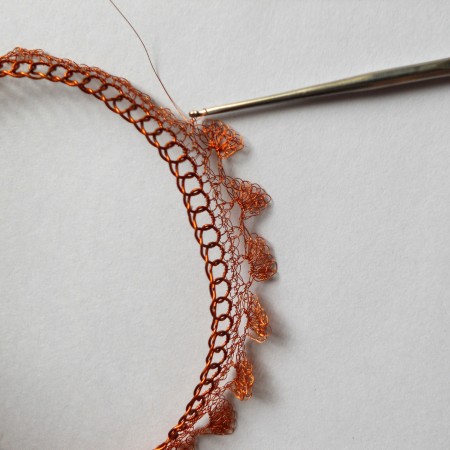 Crocheting the jagged edge to the bangle.