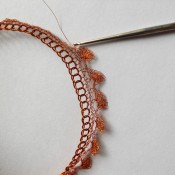 Crocheting the jagged edge to the bangle.